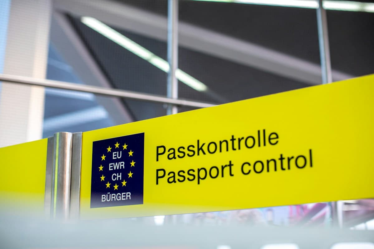 A passport control sign at a European airport